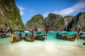 Image of long boats on Koh Phi Phi beach.